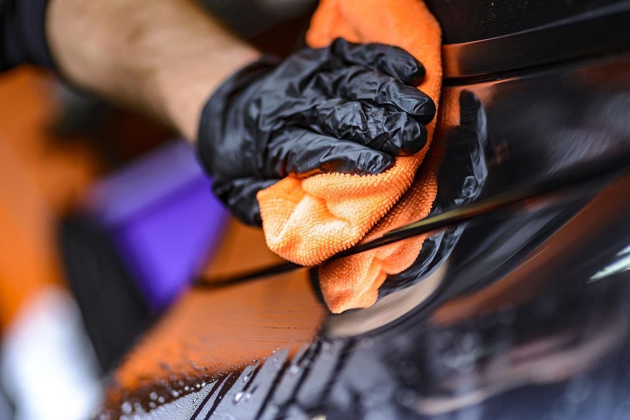 Man using a pressure washer, illustrating where to buy a pressure washer