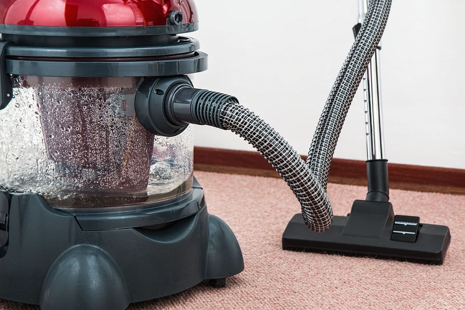 Vacuum cleaner on a carpet, a guide to how to clean a vacuum cleaner